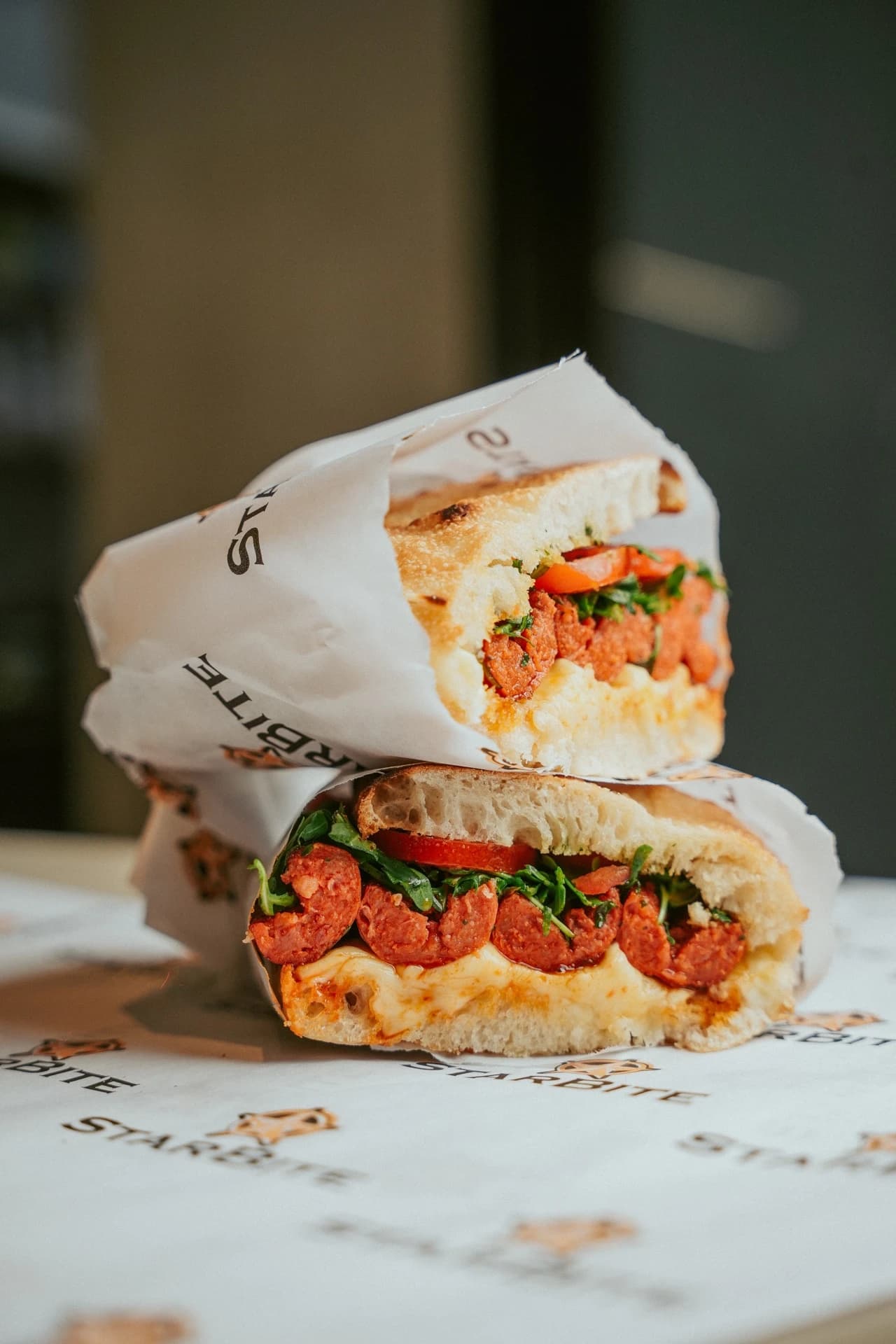 Stacked sandwich cross-section on branded paper